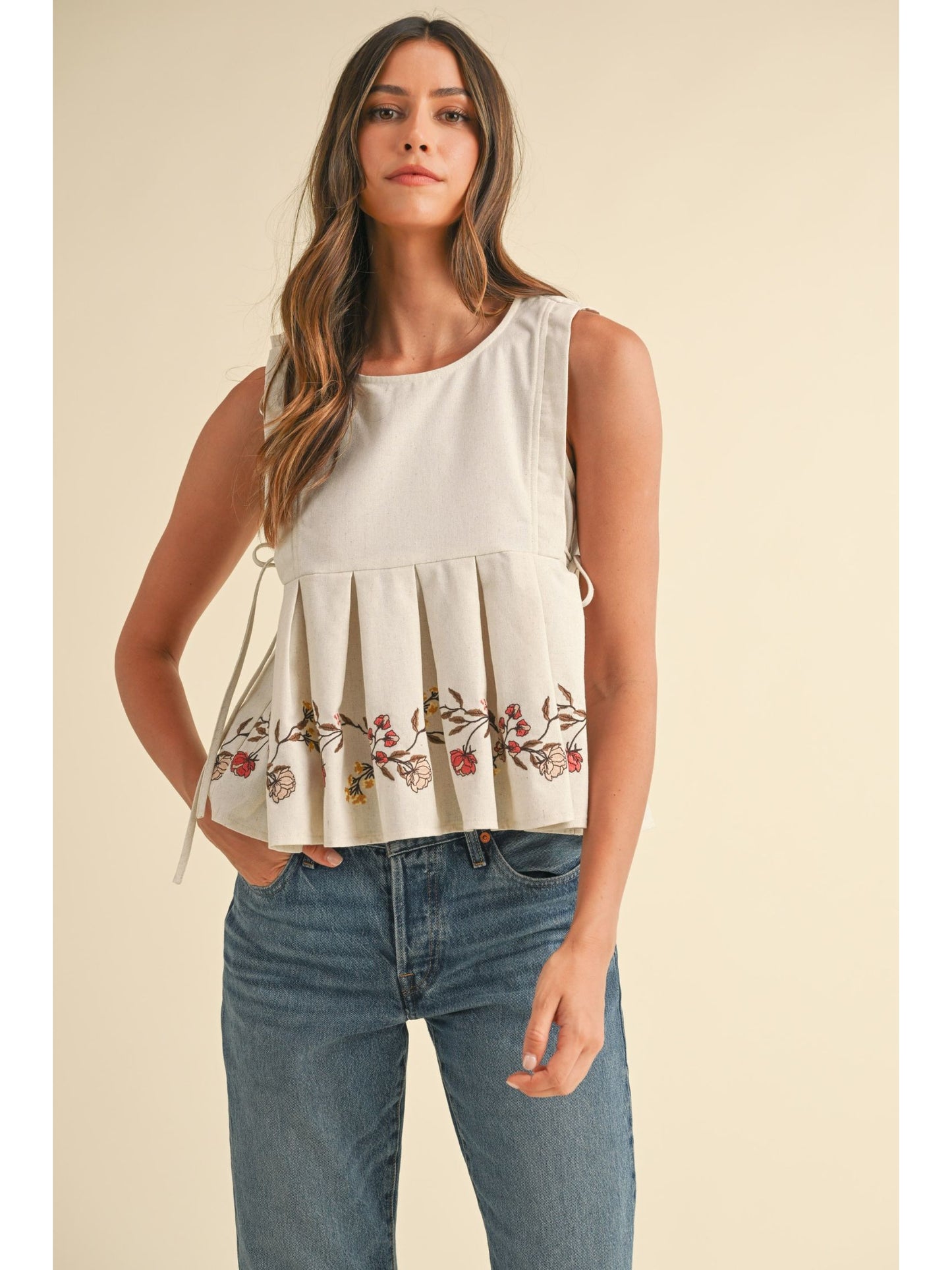 Embroidered Pleated Peplum Top