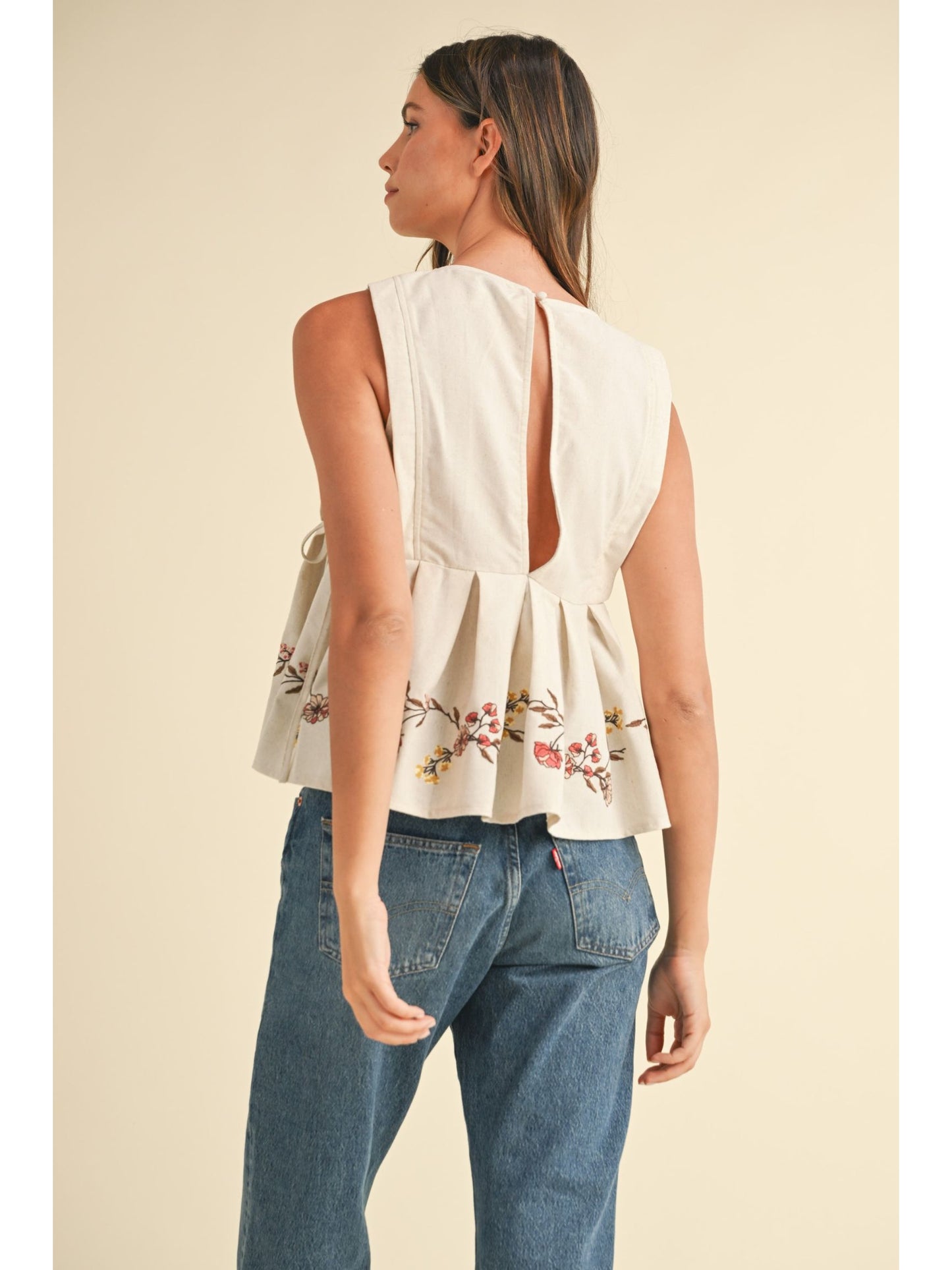 Embroidered Pleated Peplum Top