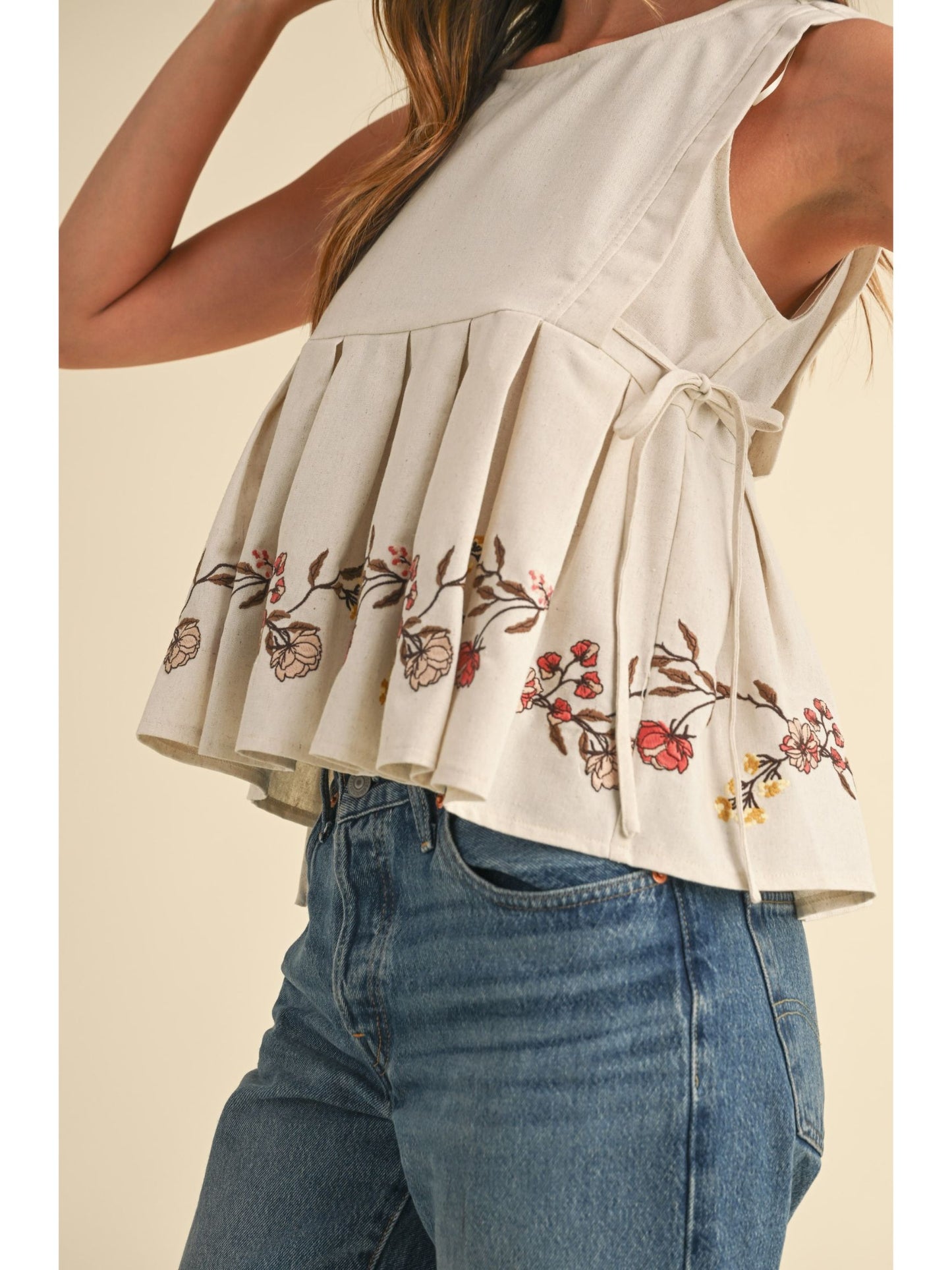 Embroidered Pleated Peplum Top